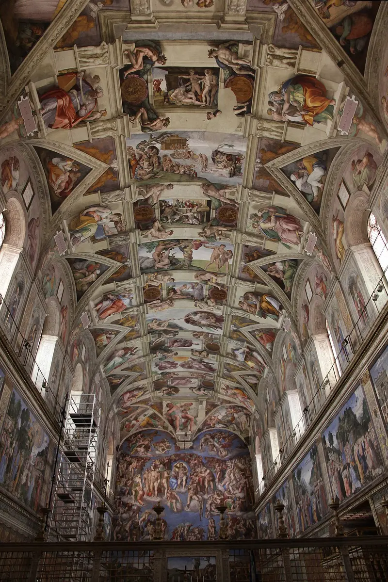 The painted ceiling and walls of the Sistine Chapel
