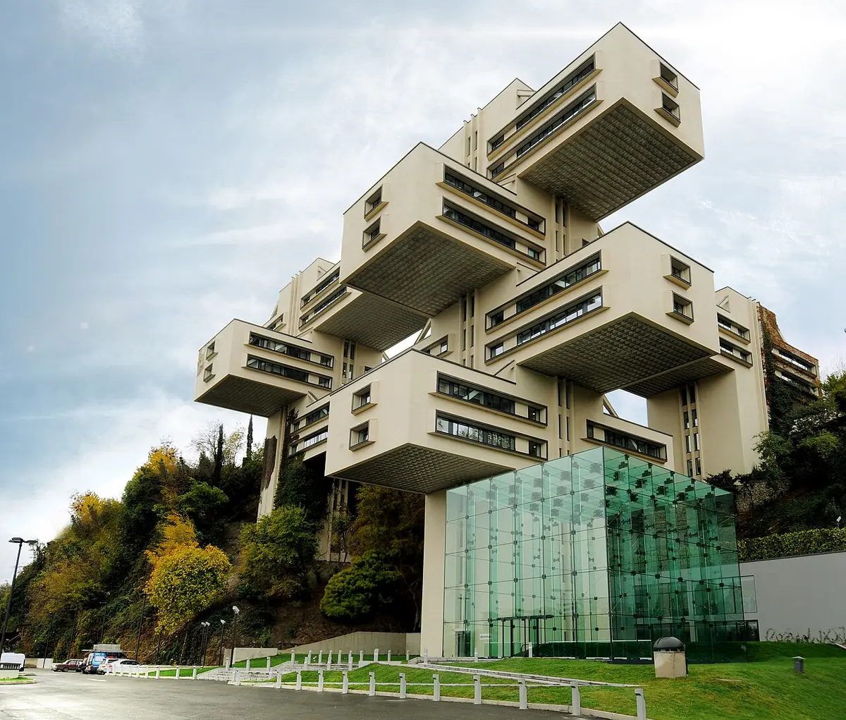 The former Ministry of Highway Construction, blocks of offices stacked crosswise on concrete towers above trees