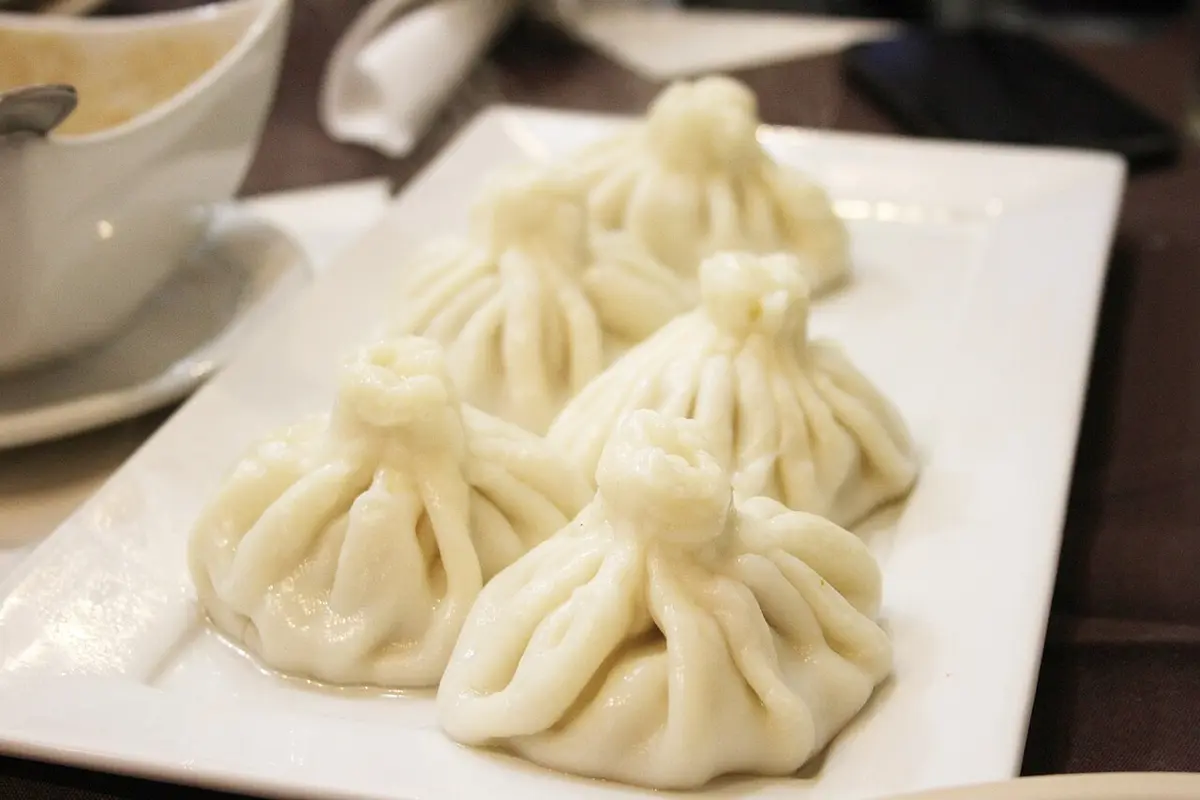 A plate of khinkali, pleated dumplings with a twisted knot on top