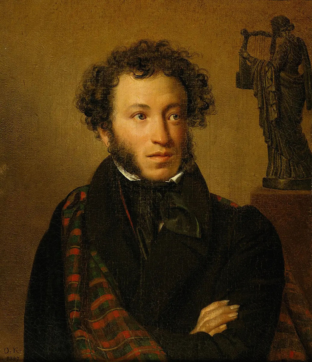 Portrait of Alexander Pushkin with his arms crossed and a tartan cloak over one shoulder