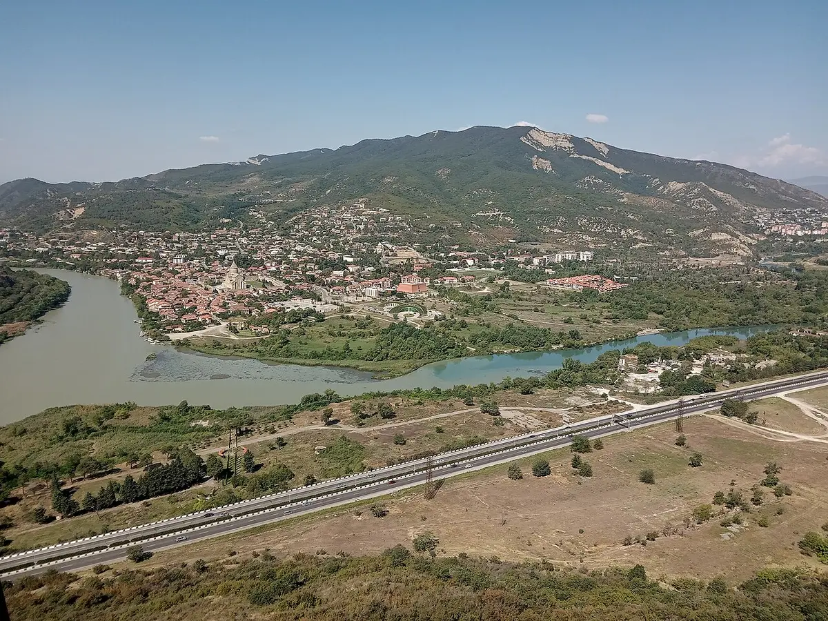Two rivers of different colors meeting below the town of Mtskheta, seen from a hilltop