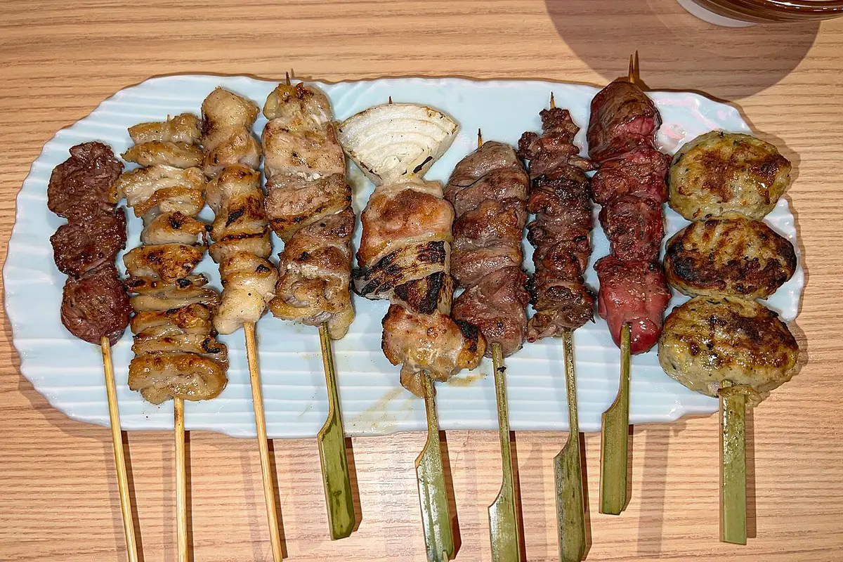 A plate of assorted yakitori skewers