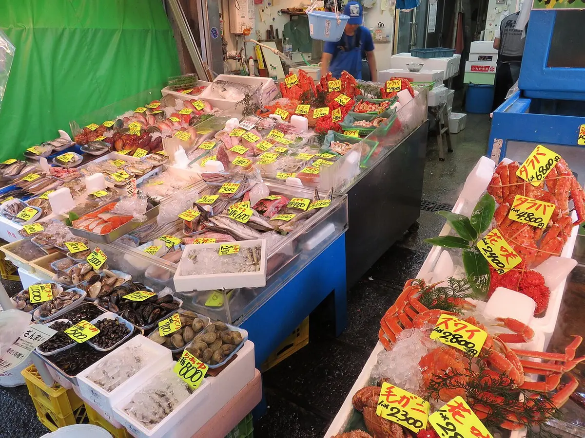 A fishmonger’s stall at the Tsukiji Outer Market with crabs, shellfish and fish on ice