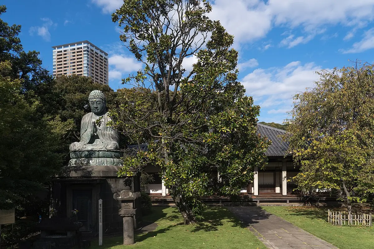 The seated bronze Buddha of Tennōji in Yanaka under a blue sky