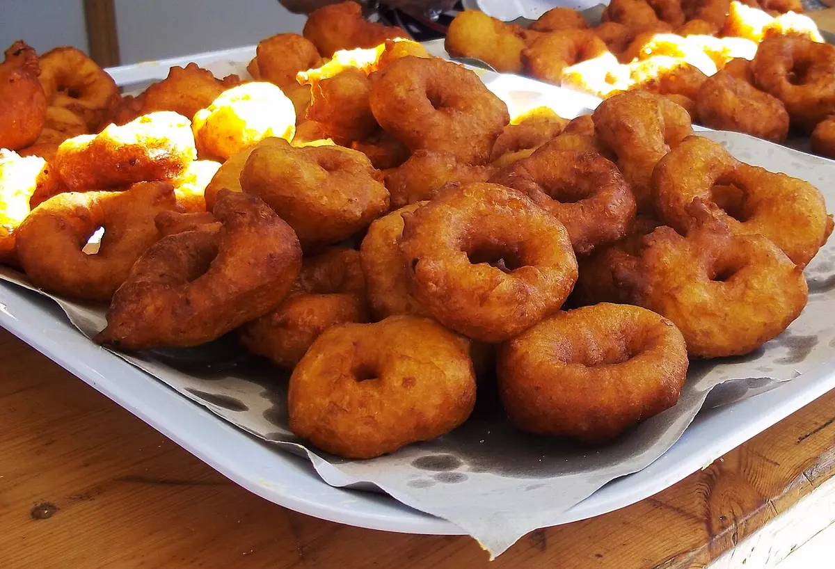 A tray of ring-shaped pumpkin fritters