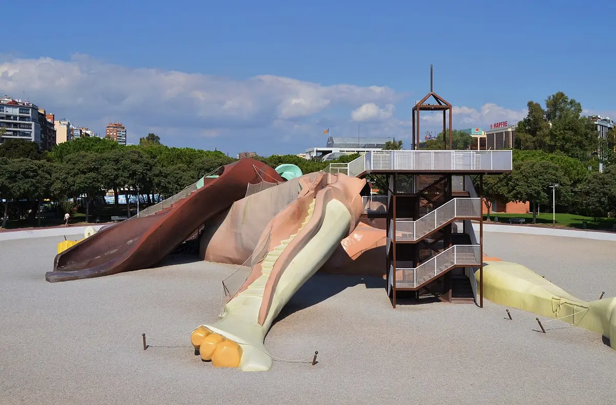 A giant figure of Gulliver lying on his back, his body made into slides and ramps, in a playground in the Turia gardens